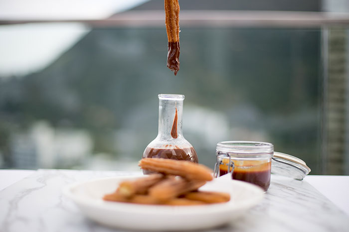 Don't miss out on the delicious churros at Komune